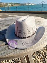 Load image into Gallery viewer, Grey cowboy hat with floral and stay wild design.
